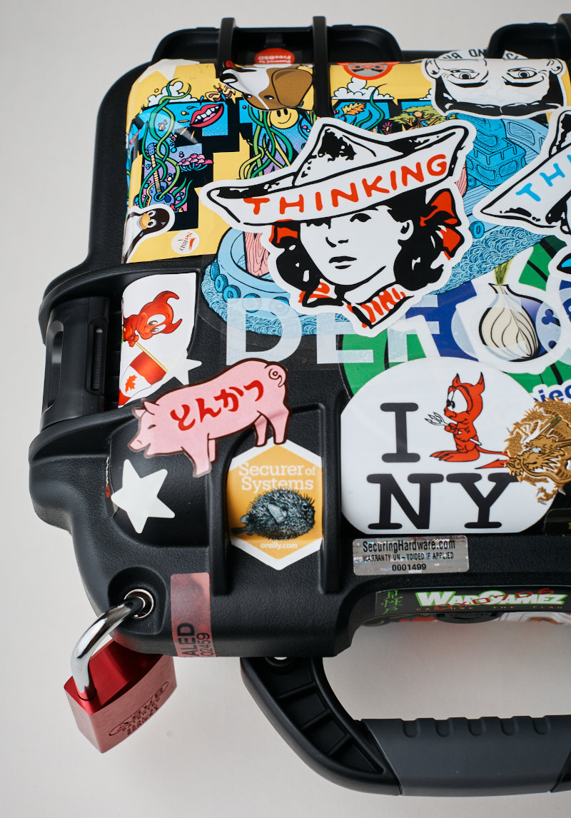Grace's Training, case detail, stickers and tamper-evident lock. Photography by Weston Wells, 2026.